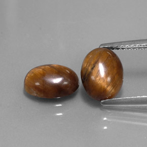 Gemas de tiger's eye marrón natural de  ct, corte óvalo, opaco