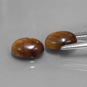 Gemas de tiger's eye marrón natural de  ct, corte óvalo, opaco