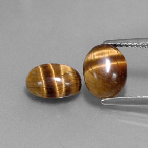 Gemas de tiger's eye marrón natural de  ct, corte óvalo, opaco