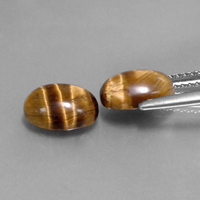 Gemas de tiger's eye marrón natural de  ct, corte óvalo, opaco