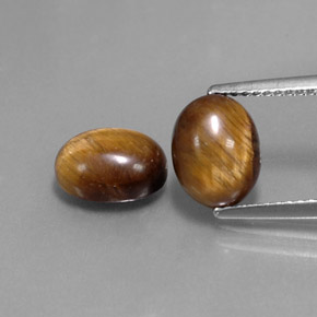 Gemas de tiger's eye marrón natural de  ct, corte óvalo, opaco