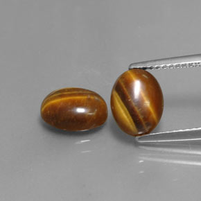 Gemas de tiger's eye marrón natural de  ct, corte óvalo, opaco