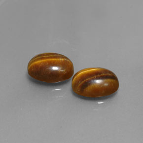 Gemas de tiger's eye marrón natural de  ct, corte óvalo, opaco