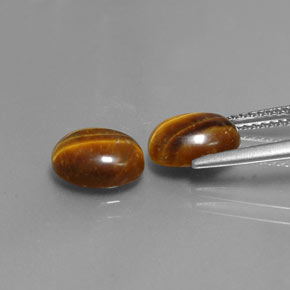Gemas de tiger's eye marrón natural de  ct, corte óvalo, opaco