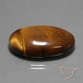 Ojo de Tigre Marrón canela intenso natural de 34.98 ct, Ovalada, Opaco