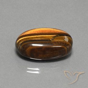 Ojo de Tigre Marrón dorado natural de 27.02 ct, Ovalada, Opaco