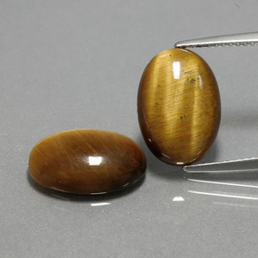 Gemas de tiger's eye marrón natural de  ct, corte óvalo, opaco