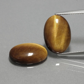 Gemas de tiger's eye marrón natural de  ct, corte óvalo, opaco
