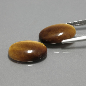 Gemas de tiger's eye marrón natural de  ct, corte óvalo, opaco