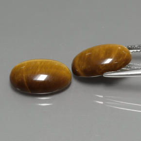 Gemas de tiger's eye marrón natural de  ct, corte óvalo, opaco