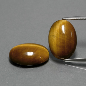 Gemas de tiger's eye marrón natural de  ct, corte óvalo, opaco