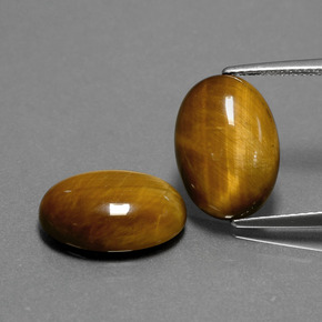 Gemas de tiger's eye marrón natural de  ct, corte óvalo, opaco