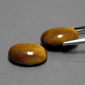 Gemas de tiger's eye marrón natural de  ct, corte óvalo, opaco