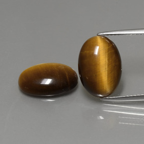 Gemas de tiger's eye marrón natural de  ct, corte óvalo, opaco