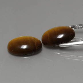 Gemas de tiger's eye marrón natural de  ct, corte óvalo, opaco