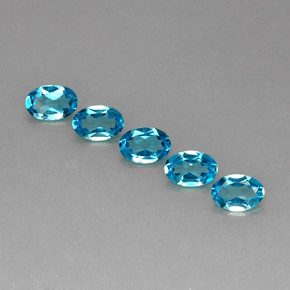Gemas de topacio azul natural de  ct, corte óvalo, VS