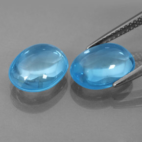 Gemas de topacio azul natural de  ct, corte óvalo, transparente