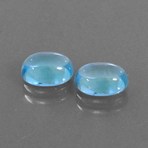 Gemas de topacio azul natural de  ct, corte óvalo, transparente