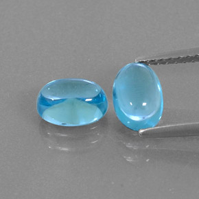 Gemas de topacio azul natural de  ct, corte óvalo, transparente