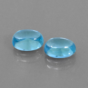 Gemas de topacio azul natural de  ct, corte óvalo, transparente