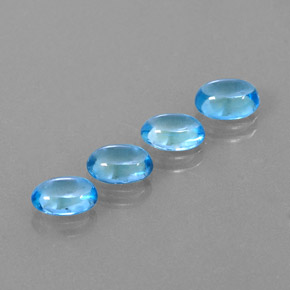 Gemas de topacio azul natural de  ct, corte óvalo, transparente