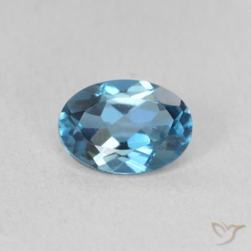 0.61ct Natural Azul Londres Topacio, Ovalada, VVS-VS