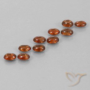 Gemas de Circón Marrón canela intenso natural de 7.73 ct, Ovalada, Transparente