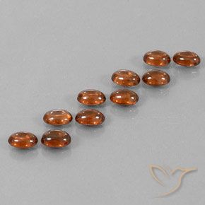 Gemas de Circón Naranja oscuro natural de 7.72 ct, Ovalada, Transparente