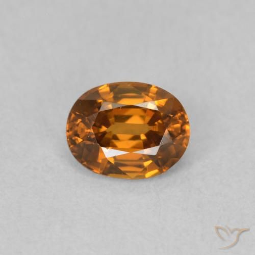 0.60ct Natural Naranja oscuro Circón, Ovalada, VVS-VS
