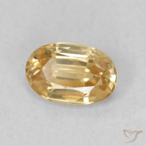 Circón Dorado durazno claro natural de 0.68 ct, Ovalada, VVS-VS