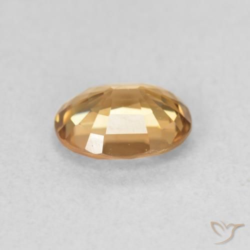 Circón Dorado medio natural de 0.82 ct, Ovalada, VS