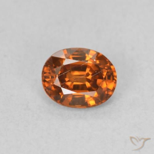 0.60ct Natural Naranja oscuro Circón, Ovalada, VS