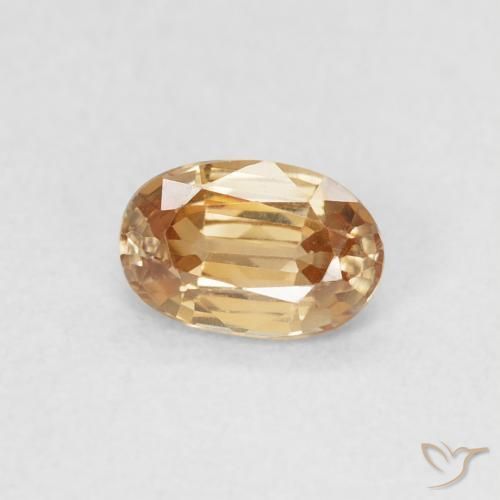 Circón Dorado durazno claro natural de 0.70 ct, Ovalada, VVS-VS