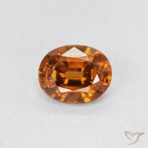 0.61ct Natural Naranja oscuro Circón, Ovalada, VS
