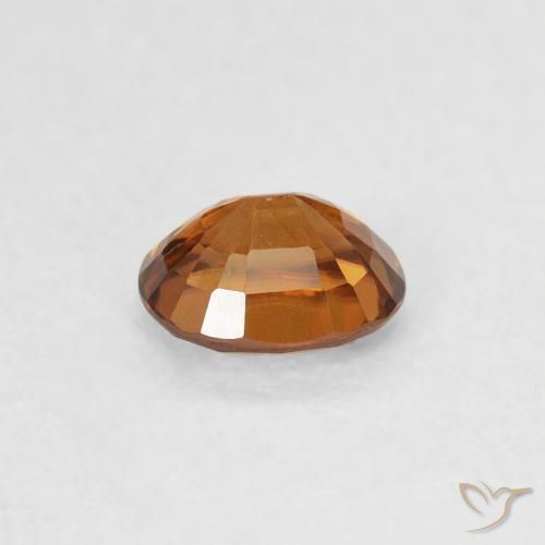 Circón Naranja oscuro natural de 0.61 ct, Ovalada, VS