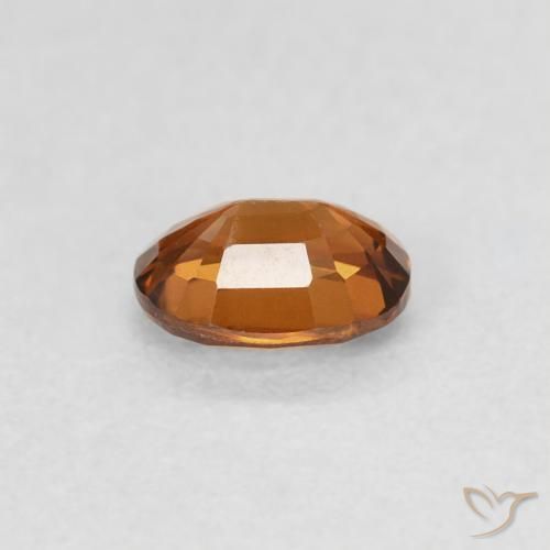 Circón Medium Dark-Orange natural de 0.60 ct, Ovalada, VS