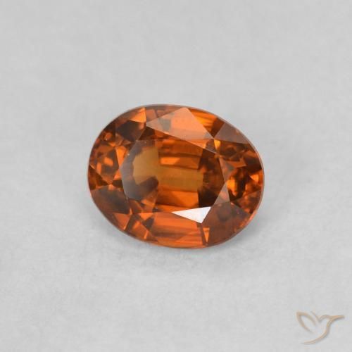Circón Naranja rojizo natural de 0.62 ct, Ovalada, VVS