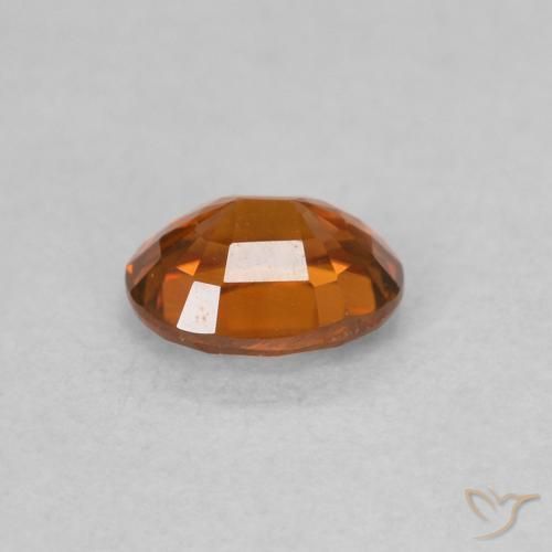 Circón Naranja rojizo natural de 0.62 ct, Ovalada, VVS