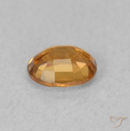 Circón Naranja oscuro natural de 0.62 ct, Ovalada, VVS