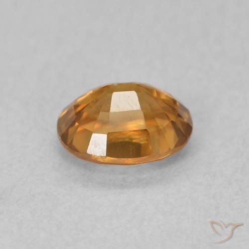 Circón Marrón naranja natural de 0.67 ct, Ovalada, VS