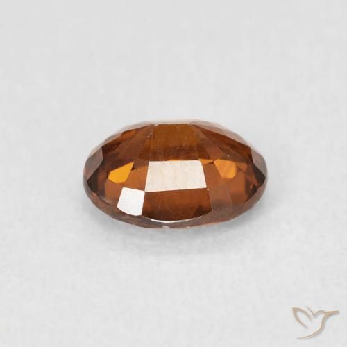 Circón Naranja rojizo natural de 0.94 ct, Ovalada, VS