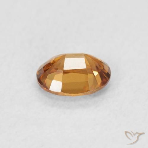 Circón Naranja oscuro natural de 0.61 ct, Ovalada, VVS