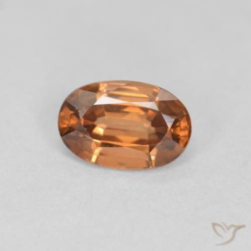 Circón Naranja oscuro natural de 0.69 ct, Ovalada, VVS-VS